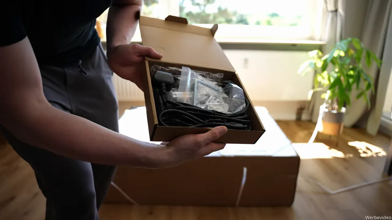 Geöffnete Zubehörbox mit Netzkabel, Adapter und Inbusschlüssel für WalkingPad X218