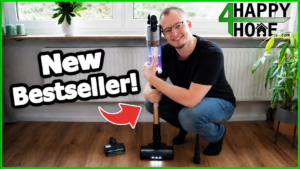 Man crouching next to the Levoit LVAC-300 cordless vacuum, headline "New Bestseller"