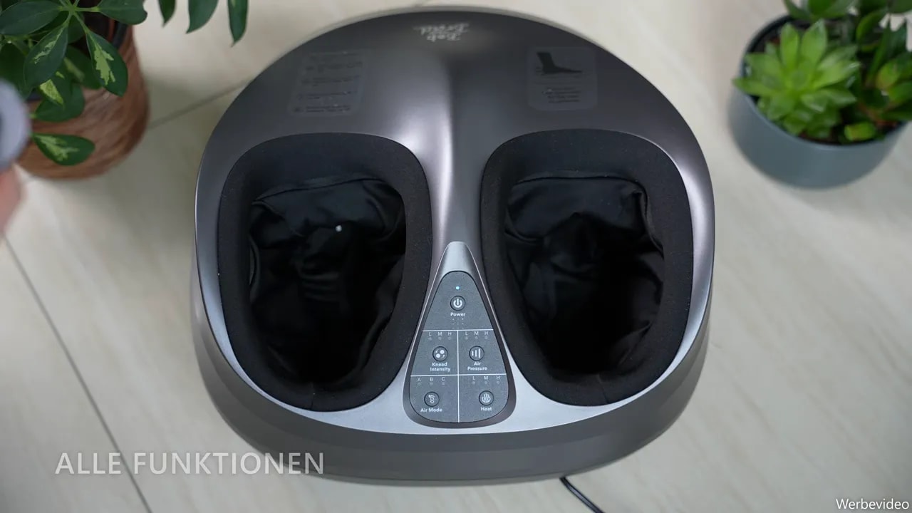 Top view of the foot massager with two foot openings, control panel and remote control